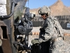 U.S. Army Spc. Justin A. Brown, of Houston, an assistant gunner with 1st section, 1st Platoon, Battery A, 2nd Battalion, 320th Field Artillery Regiment, Task Force Balls, elevates a M777 howitzer moments before it is fired from Combat Outpost Garcia in eastern Afghanistan’s Nangarhar Province Oct. 2nd. (Photo by U.S. Army Sgt. Albert L. Kelley, 300th Mobile Public Affairs Detachment)