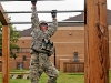 Spc. Oscar Pantoja, a rifleman with Company C, 2nd Battalion, 502nd Infantry Regiment, 2nd Brigade Combat Team, 101st Airborne Division (Air Assault), swings across the monkey bars during the monthly Iron Strike Challenge at Fort Campbell, KY, September 15th. The competition is held monthly, with teams from each battalion within the brigade facing-off against each other in a series of physically demanding events. (U.S. Army Photo By Spc. Shawn Denham, PAO, 2nd BCT, 101st Abn. Div.)