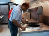 Tandoor owner Hakeem inspects his new tandoor oven