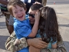 A Soldier with the Tennessee National Guard’s 230th Signal Company embraces his kids after returning home from a year-long deployment overseas Oct. 14. (Spc. Lauren Ogburn, Tennessee National Guard Joint Force Headquarters).