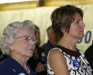 Tim\'s mother and wife listen as he addresses his supporters