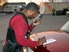 Detective Tracy Woodruff checking radio traffic. (Photo by CPD-Jim Knoll)