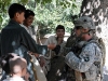 U.S. Army Spc. Kermit O. Scott of Columbia, SC, a team leader with 3rd Platoon, Company D, 1st Battalion, 327th Infantry Regiment, Task Force Bulldog, greets children in Samatan village in eastern Afghanistan’s Kunar Province Sept. 24th. (Photo by U.S. Army Staff Sgt. Gary A. Witte, 300th Mobile Public Affairs Detachment)