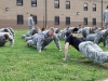 Lt. Col. Thomas M. Gaston Jr., commander of the 129th Combat Sustainment Support Battalion, 101st Sustainment Brigade ?Lifeliners,? 101st Airborne Division (Air Assault), leads participants in the ?Wedge Challenge? as they perform push-ups before negotiating an obstacle course during April 25, 2014 at Fort Campbell, Ky. The ?Wedge Challenge? was an air assault competition that tested battalion leaders with a packing list layout, foot march, sling load inspection, an obstacle course and tug of war. (U.S. Army photo by Sgt. 1st Class Mary Rose Mittlesteadt, 101st Sustainment Brigade Public Affairs)