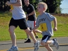 A young child sprints along Air Assault Rd. in support of honoring those who have made the ultimate sacrifice during a Run for the Fallen during Fort Campbell’s Week of the Eagles 2012, Aug. 11th.  The run was open to families, Soldiers, Veterans and anyone who wanted to pay their respects. (U.S. Army photo by Spc. Sara Connolly, 2nd BCT PAO, 101st ABN.DIV)