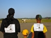 Spc. Tracey Hoffstrom, a fuel handler with the 2nd Brigade Special Troops Battalion, 2nd Brigade Combat Team, 101st Airborne Division (Air Assault) and sons Alex and Brandon, pay tribute to the Fallen Screaming Eagles prior to the Run for the Fallen at The Sabalauski Air Assault School on Fort Campbell Aug. 11th. The memorial run is part of The Week of the Eagles 2012, a weeklong celebration of the 101st Airborne Division. (U.S.Army photo by Spc. Sara Connolly, 2nd BCT PAO, 101st ABN.DIV)