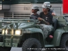 Three soldiers pass by in a jeep backstage at the Salute to the Troops Concert at Fort Campbell KY