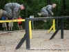 2nd Lt. Eberts and 1st Lt. Joey Keller Jumping over the six vault obstacle  at the Toughest Air Assault Soldier Competition