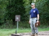 A judge waits for the next contestant for the belly crawl obstacle at the Toughest Air Assault Soldier Competition