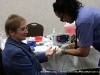An attendee getting a battery of free medical screenings