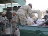 Zone 1 Afghan Border Police load school supplies onto their truck to deliver school supplies to school kids, May 25, 2013, at Headquarters Zone 1, Jalalabad, Nangarhar Province, Afghanistan. (U.S. Army photo by Sgt. Jon Heinrich, CT 1-101 Public Affairs)