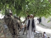 Local Afghan school teachers greet Afghan National Security Forces and U.S. Army Soldiers with Afghan Border Police Zone 1 Security Forces Advise and Assistance Team, 1st Brigade Combat Team, 101st Airborne Division, May 25, 2013, in Jalalabad, Nangarhar Province, Afghanistan. The SFAAT accompanied ANSF to a local school where the ANSF handed out school supplies to local children. (U.S. Army photo by Sgt. Jon Heinrich, CT 1-101 Public Affairs)