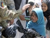 A local Afghan schoolgirl smiles after she receives school supplies from Afghan Border Police and 2nd Brigade Afghan National Civil Order Police soldiers during a community outreach mission, May 25, 2013, in Jalalabad, Nangarhar Province, Afghanistan. (U.S. Army photo by Sgt. Jon Heinrich, CT 1-101 Public Affairs)