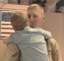 Ensign Bill Hawse greets his son after returning from Iraq after 7 months away.