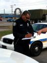 A Clarksville, TN Police officer takes a accident report (From: ClarksvillePD.org)