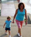 A mother with her child in tow heads up the stairs