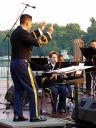 Commender of the 91st Division band CW2 Richard Servantez launches into the first number