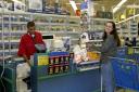 Woman holding a toy she is about to purchase