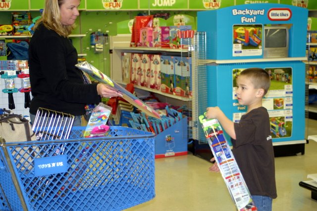 Mother and son shopping for kites