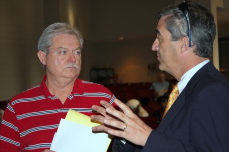 Don Sharp (L) speaks to Co-Interim City Attorney Tim Harvey (R)