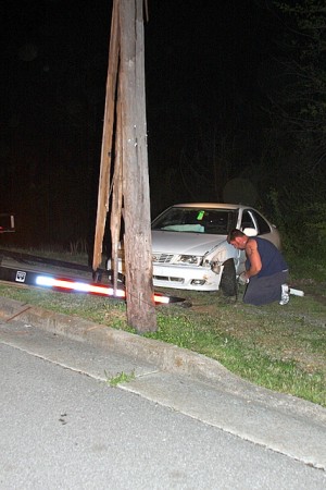 Aaron Trammell of T&T towing hooking up the vehicle 