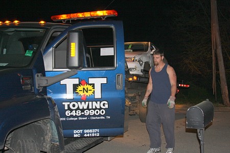 Moving the vehicle clear of the damaged light pole before securing the load.