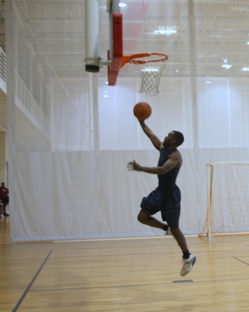 An APSU student does a layup shot in the campus fitness center