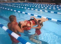 Lifeguards undergoing training to be proficient in their life saving skills