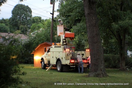 A CDE Electrical truck in the backyard of a home doing electrical repair work after the storm.