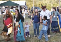 Native Women in regalia dance during the Powwow