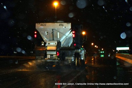 Salt truck salts the railway overpass on Ted A. Crozier Blvd.