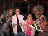 Carlie and Destiny Lane pose with Cats.