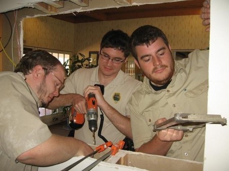 David Britton of Port Royal gets enthusiastic help from Ranger Adam Neblett and Seasonal Interpreter Michael Fulbright.