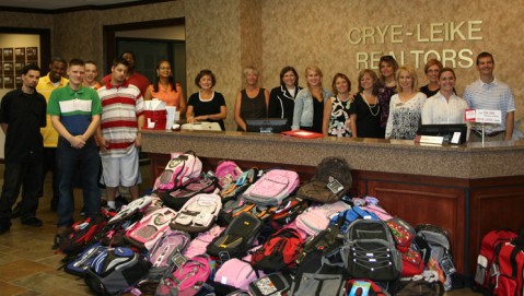 Children and staff from Youth Villages prepare to pick-up nearly 300 donated backpacks from Crye-Leike, REALTORS Agents at the company's Brentwood West Regional Headquarters in August 2008