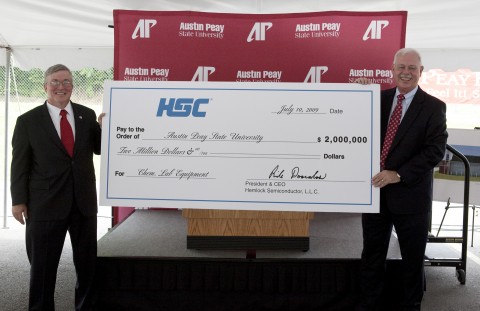 APSU President Tim Hall (left) is presented with a $2 million contribution from Hemlock Semiconductor Group, represented by Terry Strange, site manager of the new Hemlock Semiconductor plant in Clarksville. (Rollow Welch/APSU Public Relations and Marketing)