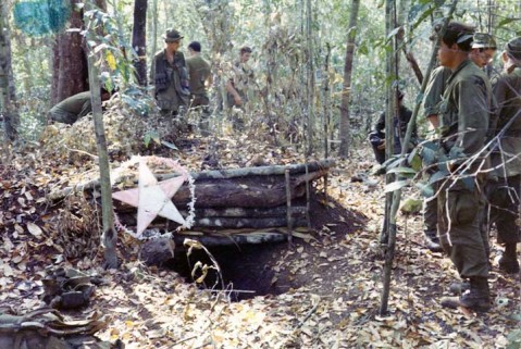 Looking more like something born of a Boy Scout jamboree than the entrances to enemy bunkers, these Vietcong encampments could be lethal to anyone encountering them in the jungle. -  Vaughn Banting