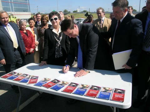 TDOT Chief Engineer Paul Degges, surrounded by key safety partners, signs the new Strategic Highway Safety Plan