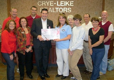 Crye-Leike, REALTORS Presents Its First Big Check of $3,771 to Operation Homefront. Pictured Left to Right: Romney Hill, Paula Fuller, Rob Hatchett, Operation Homefront Representative Tina Englen, Englen’s son, Jill Solava, Digger Williams, Ben Claybaker, Linda Brock, Joe Lehman, David Thomas.