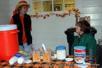 Volunteers stand ready to serve refreshing drinks