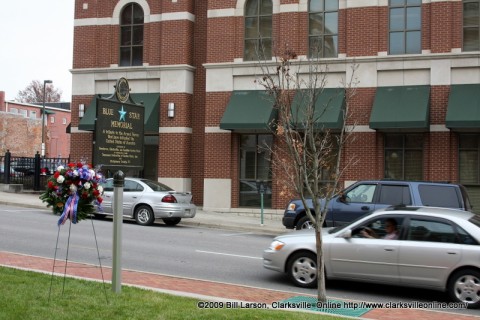 A driver looks at the Blue Star Memorial as he drives by