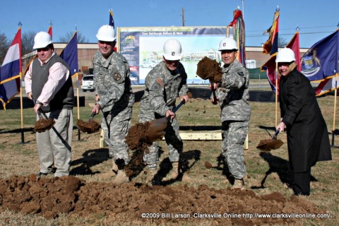 Major General John F. Campbell (center) leads the groundbreaking for the new Commissary on Fort Campbell