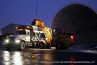 A frontend loader resupplies a salt truck at the TDoT Depot in Montgomery County