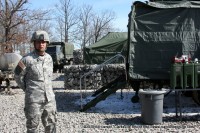 SSG. Thomas Martin in front of his Portable Mess Unit