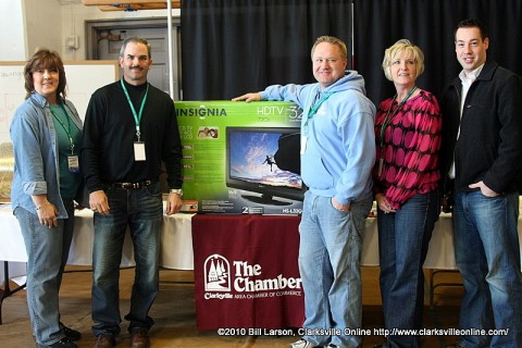 The Clarksville Area Chamber of Commerce with one of the televisions they gave away