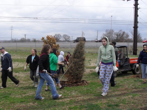 During spring break 40 college students from North Dakota State University and the surrounding area, rolled up their sleeves and volunteered their time mulching around the many trees found at Heritage Park