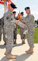 U.S. Army Command Sergeant Major (CSM) Scott Schroeder the division CSM and Major General John Campbell the Commanding General of the 101st Airborne Division (Air Assault) “Screaming Eagles” case the division colors during the casing ceremony outside of McAuliffe Hall at Fort Campbell, KY on 19 May 2010.  The division will be deploying to Afghanistan during the next few weeks.  This is the fourth time the division has cased their colors and deployed since 9-11.  U.S. Army Photo by Sam Shore