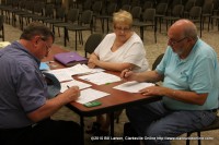 Flood victims receiving assistance from Disaster Recovery Center personnel