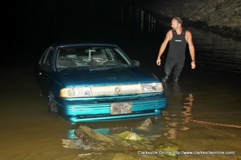 Montgomery County Rescue Squad diver Tim Manners inspects the car as it is pulled from the water Montgomery County Rescue Squad diver Tim Manners inspects the car as it is pulled from the water