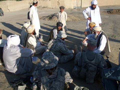 Task Force Iron Soldiers speak with local tribal elders in the village of Jarkana at a "shura" or town meeting following a recent joint air-assault mission with members of the Afghan Uniform Police. The village, located in Paktika Province, has historically been a Taliban safehaven. Task Force Iron Soldiers hope to change that and help increase security for the village with assistance from the AUP. Task Force Iron Soldiers speak with local tribal elders in the village of Jarkana at a "shura" or town meeting following a recent joint air-assault mission with members of the Afghan Uniform Police. The village, located in Paktika Province, has historically been a Taliban safehaven. Task Force Iron Soldiers hope to change that and help increase security for the village with assistance from the AUP.