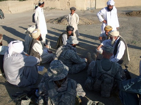 Task Force Iron Soldiers speak with local tribal elders in the village of Jarkana at a "shura" or town meeting following a recent joint air-assault mission with members of the Afghan Uniform Police.  The village, located in Paktika Province, has historically been a Taliban safehaven.  Task Force Iron Soldiers hope to change that and help increase security for the village with assistance from the AUP.